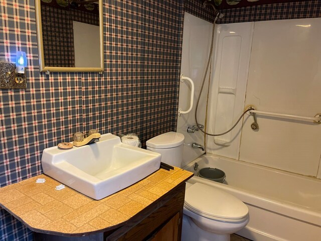 full bathroom featuring vanity, toilet, and tub / shower combination