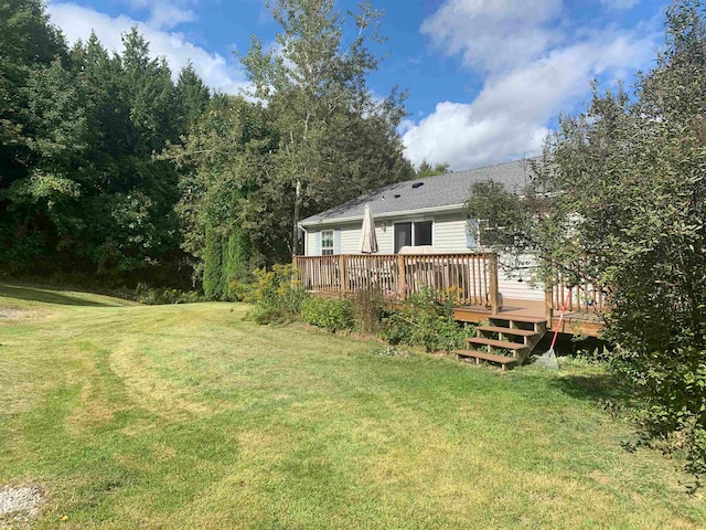 view of yard with a wooden deck