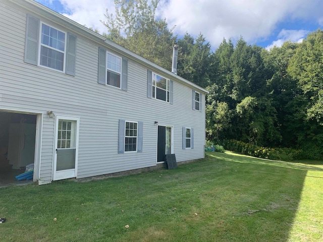 rear view of house with a lawn