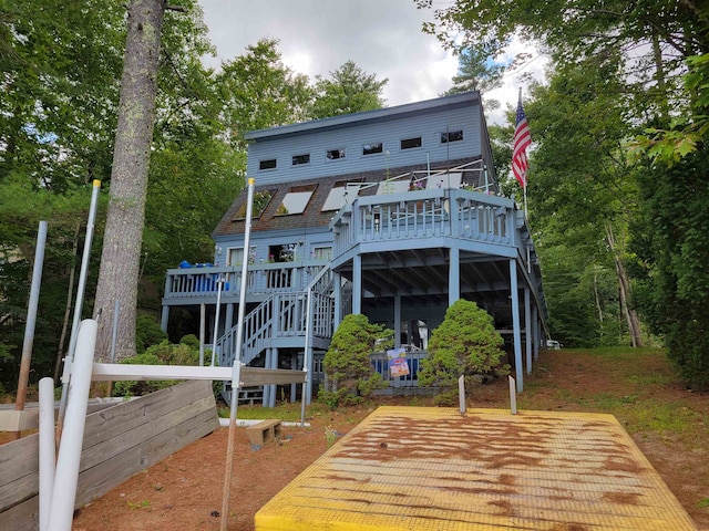 back of property featuring a deck