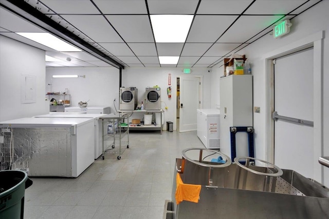 interior space with washer and clothes dryer and electric panel