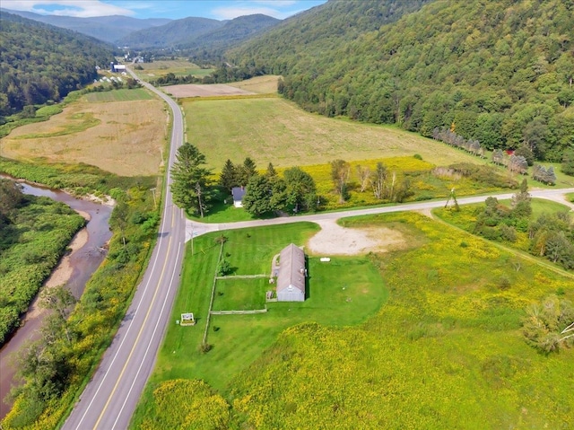 birds eye view of property with a rural view