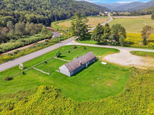 birds eye view of property with a rural view