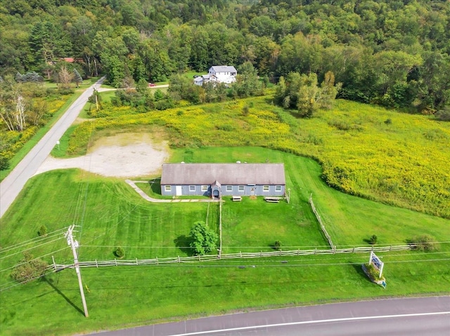 birds eye view of property with a rural view