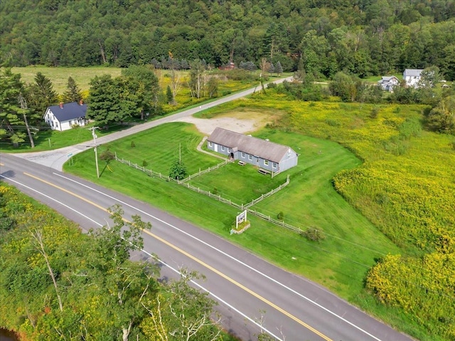 birds eye view of property featuring a rural view and a forest view