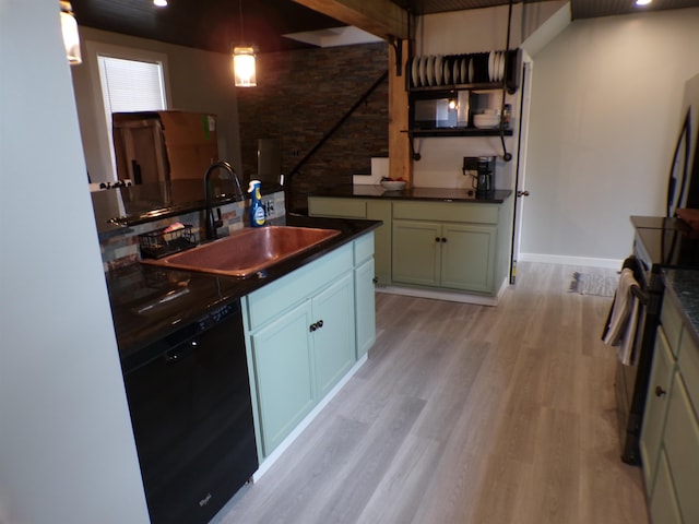 kitchen with light wood-type flooring, pendant lighting, range with electric stovetop, sink, and black dishwasher