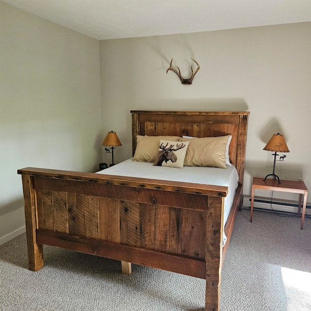 carpeted bedroom with a baseboard radiator