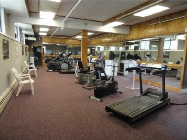 exercise room with wood walls