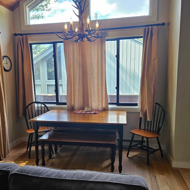 dining room with a notable chandelier and hardwood / wood-style floors