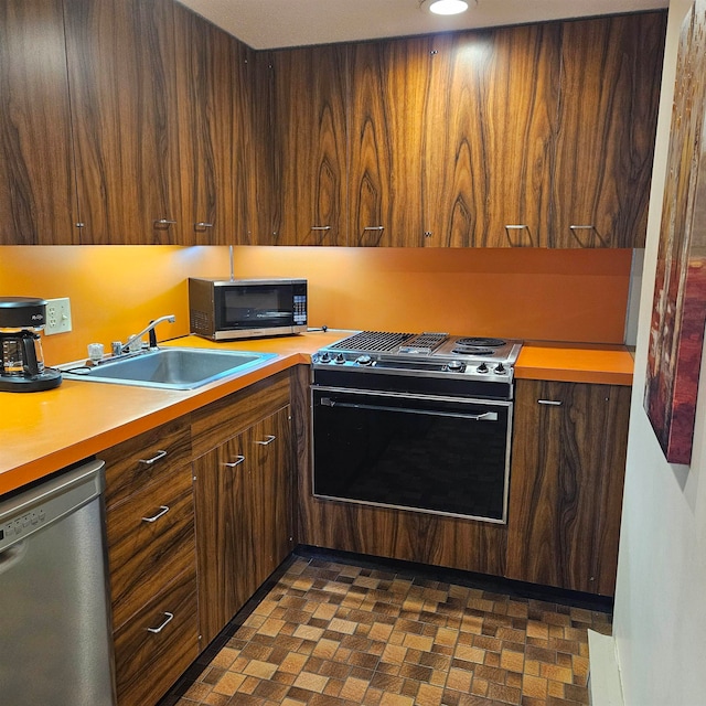 kitchen featuring appliances with stainless steel finishes and sink