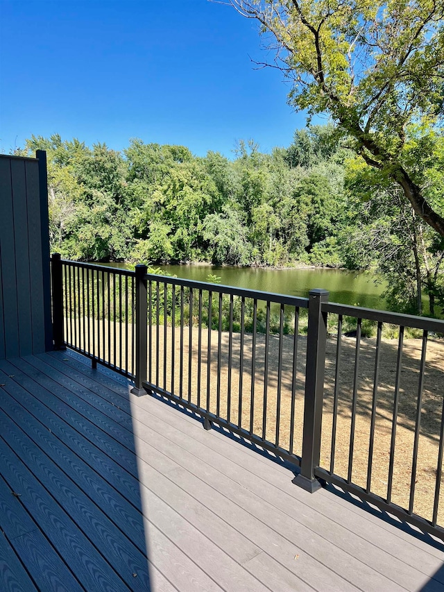 wooden terrace with a water view