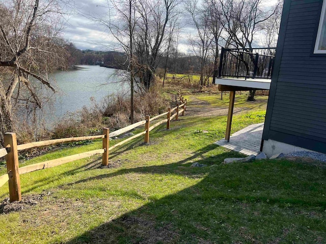 view of yard featuring a deck with water view