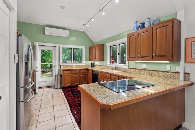 kitchen with a wall mounted AC, sink, lofted ceiling, black appliances, and kitchen peninsula