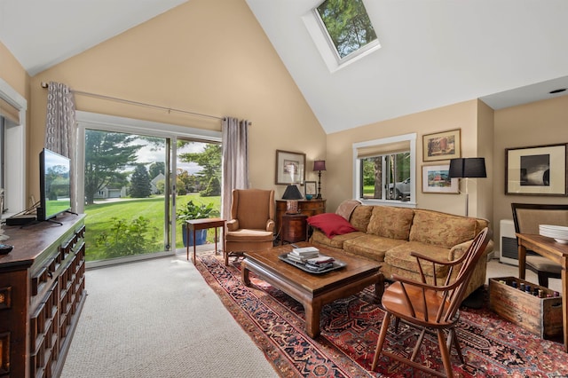 carpeted living room with high vaulted ceiling, a healthy amount of sunlight, and a skylight