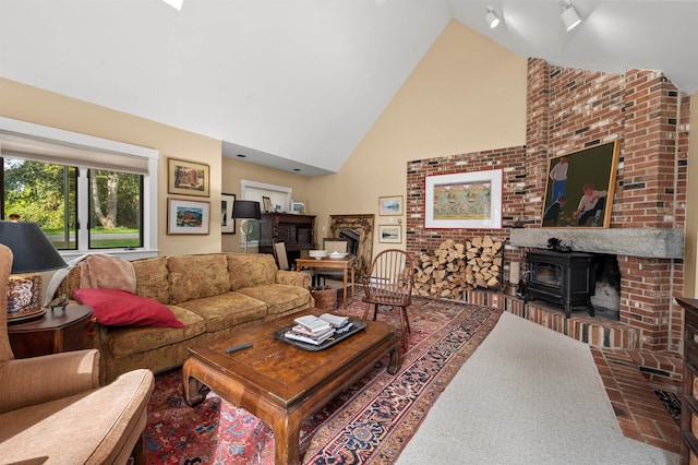 carpeted living room featuring a wood stove and high vaulted ceiling