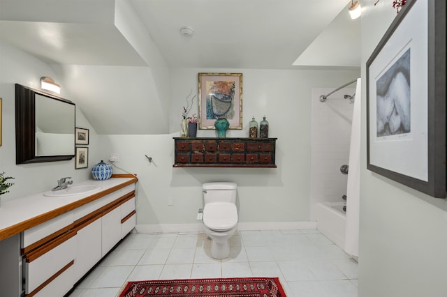 full bathroom featuring tile patterned flooring, tiled shower / bath, toilet, and vanity