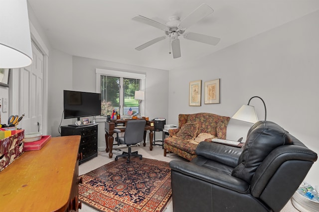 living room with light colored carpet and ceiling fan