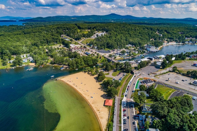 aerial view featuring a water and mountain view