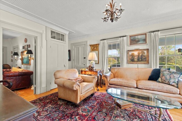 living room with wood-type flooring and a notable chandelier