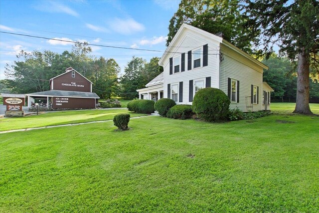 view of home's exterior featuring a yard