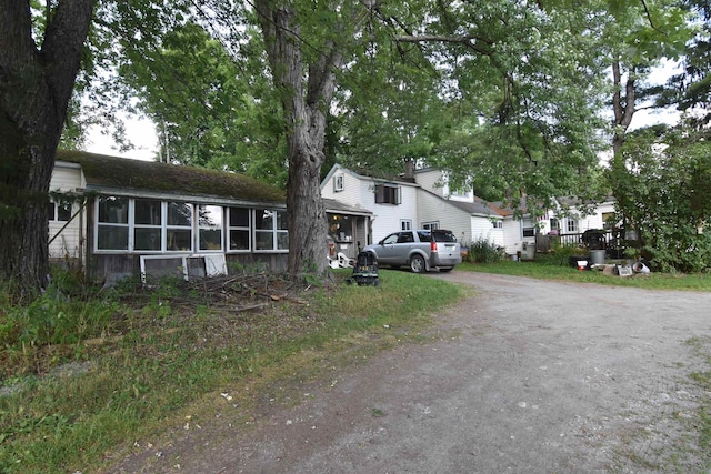 view of front of property featuring a sunroom