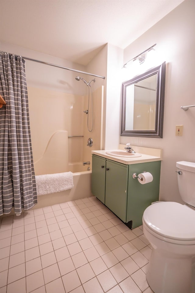 full bathroom featuring tile patterned floors, tub / shower combination, toilet, and vanity