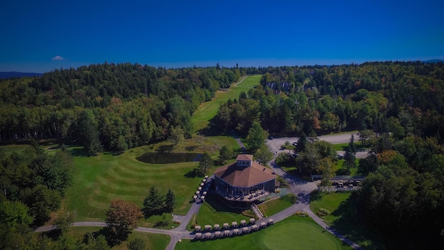 aerial view featuring a wooded view