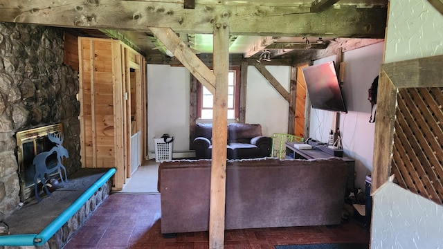 unfurnished living room with parquet floors, a fireplace, and a baseboard radiator