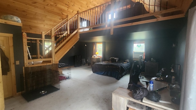 living room featuring concrete flooring, wood ceiling, and high vaulted ceiling