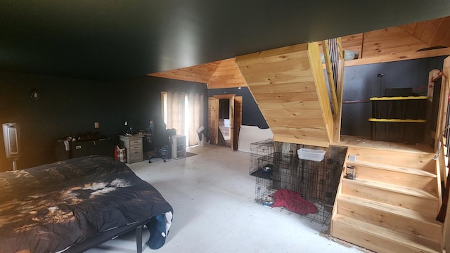 bedroom featuring concrete flooring