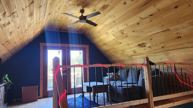 bedroom with wood ceiling, lofted ceiling, multiple windows, and hardwood / wood-style flooring