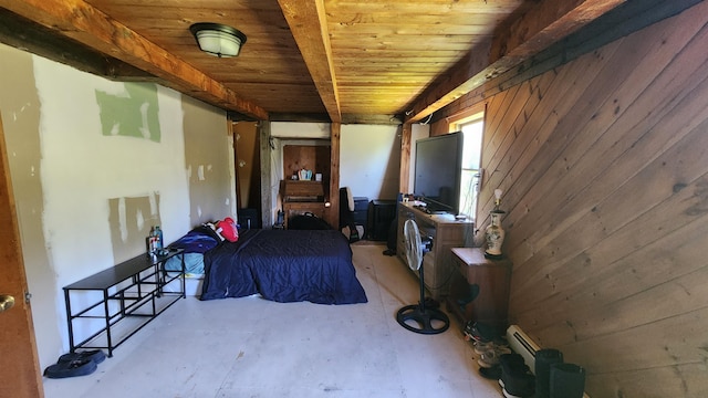 bedroom with wood ceiling, beam ceiling, and wooden walls