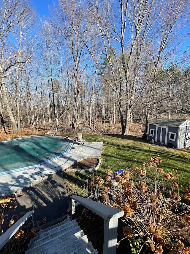 view of yard featuring a covered pool