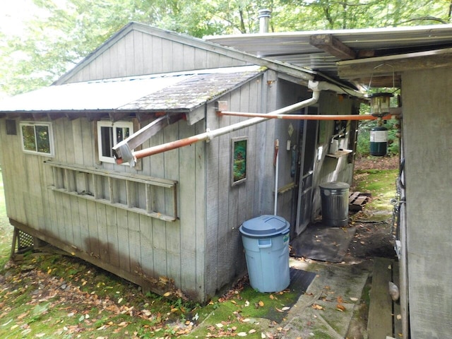 view of side of home with an outbuilding