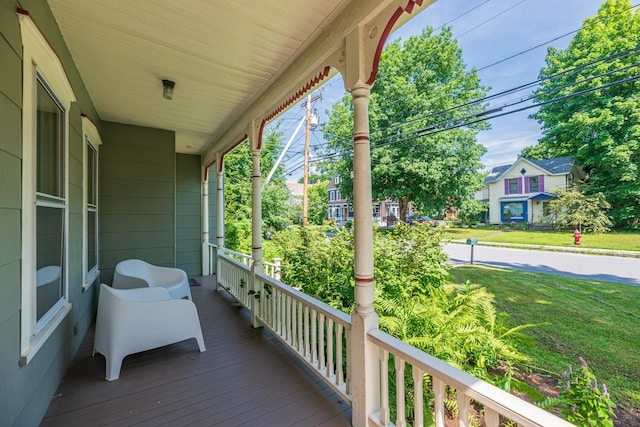 wooden terrace with a porch