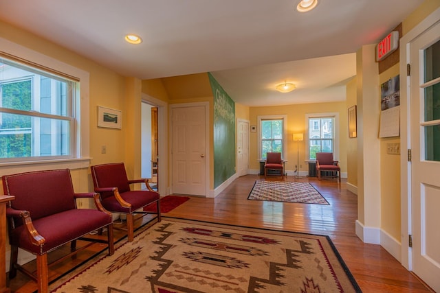foyer entrance featuring baseboards, recessed lighting, and wood finished floors