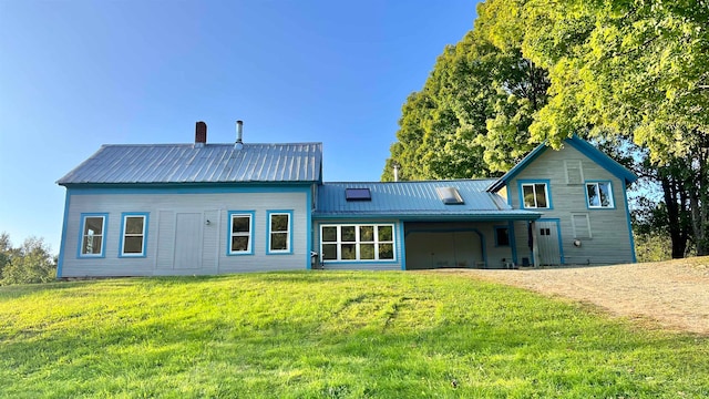 rear view of house with a lawn