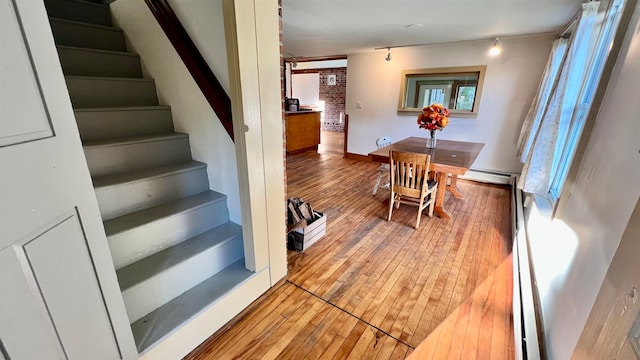 interior space featuring a baseboard radiator and hardwood / wood-style flooring