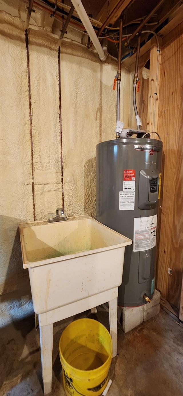 utility room featuring sink and electric water heater