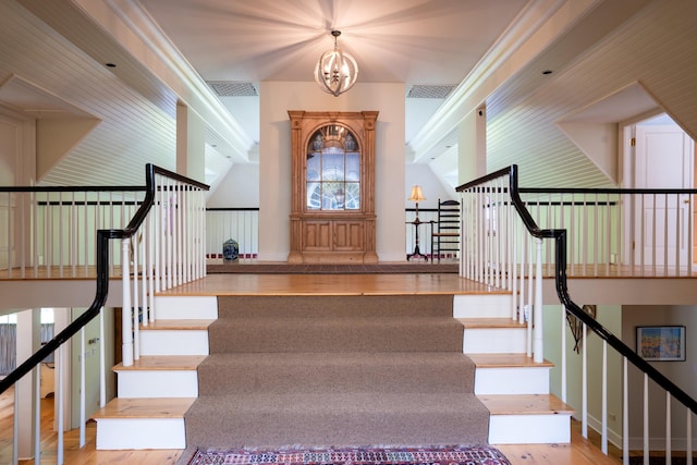 interior space with wood finished floors, visible vents, and a chandelier