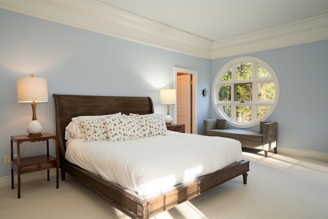 bedroom with baseboards and light carpet