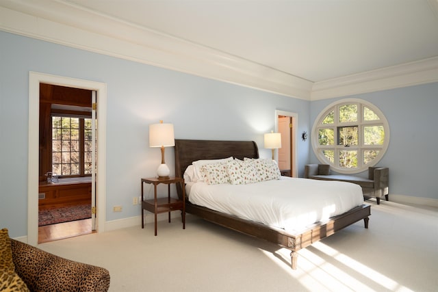 bedroom featuring crown molding, carpet, and baseboards