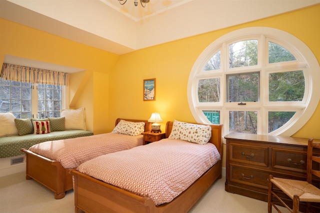 bedroom with visible vents and light colored carpet