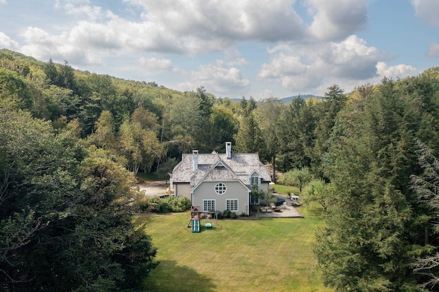 bird's eye view featuring a forest view