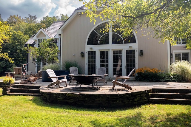 back of property featuring a yard and a patio area