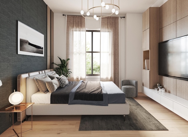 bedroom featuring a chandelier and light hardwood / wood-style floors