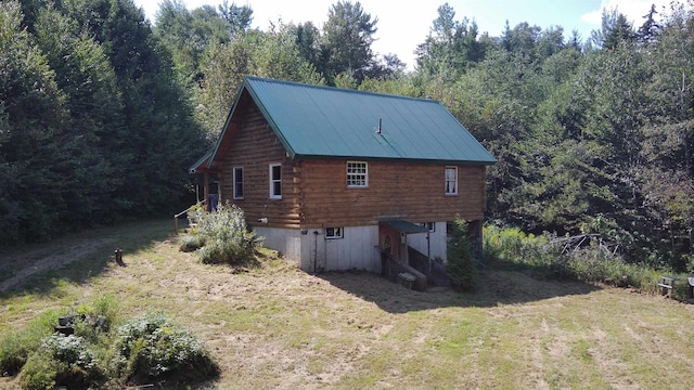 view of home's exterior featuring a lawn