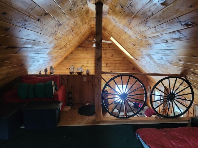 interior space with wood ceiling, wooden walls, and vaulted ceiling