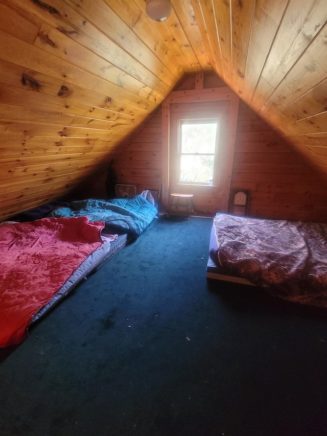 carpeted bedroom featuring lofted ceiling, wood walls, and wooden ceiling