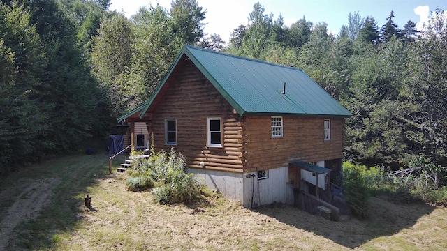 view of home's exterior featuring a yard